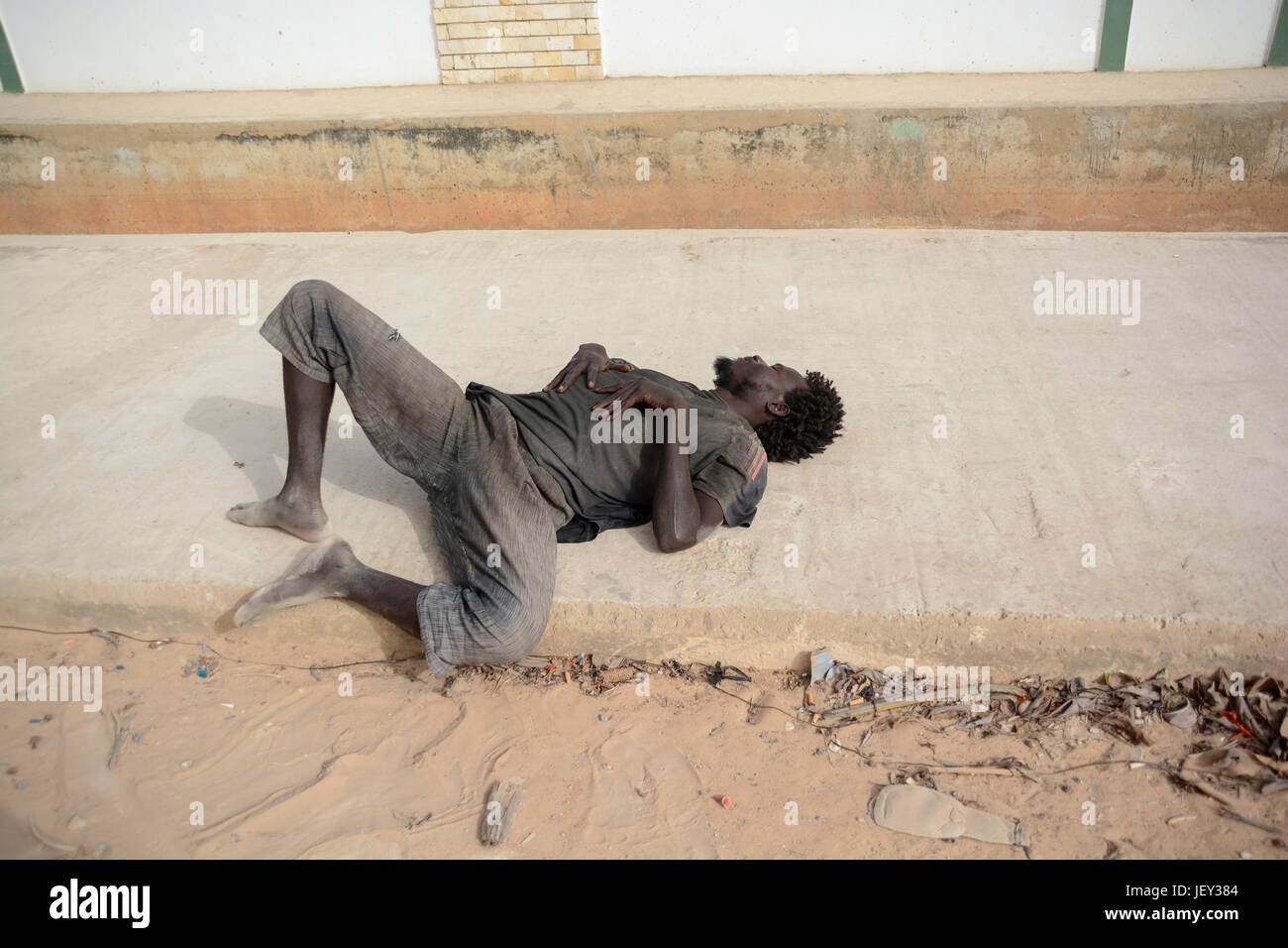Drunk man laying on road hi-res stock photography and images - Alamy