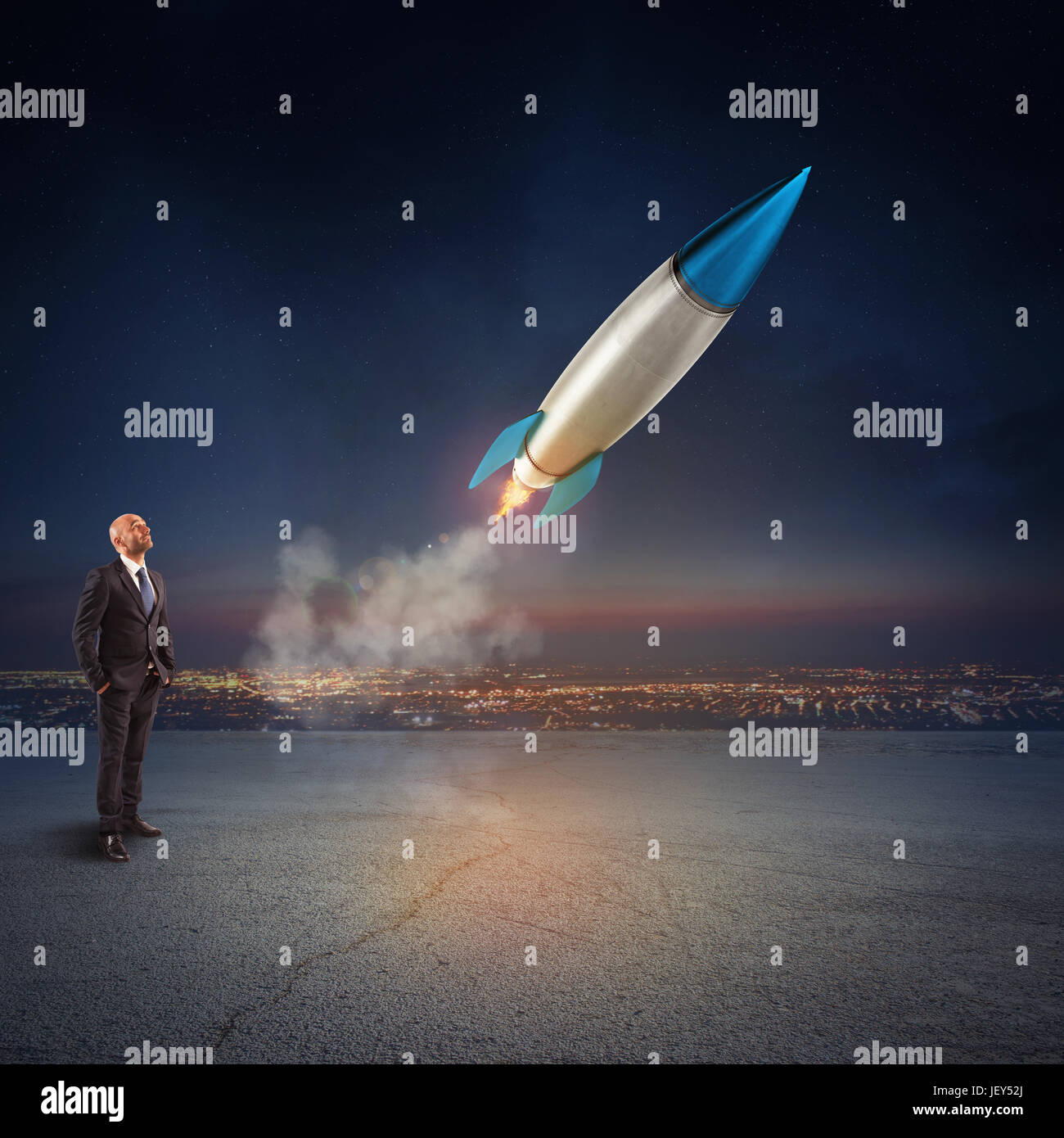 Businessman looks start a missile. Concept of company startup and new business. 3D Rendering. Stock Photo