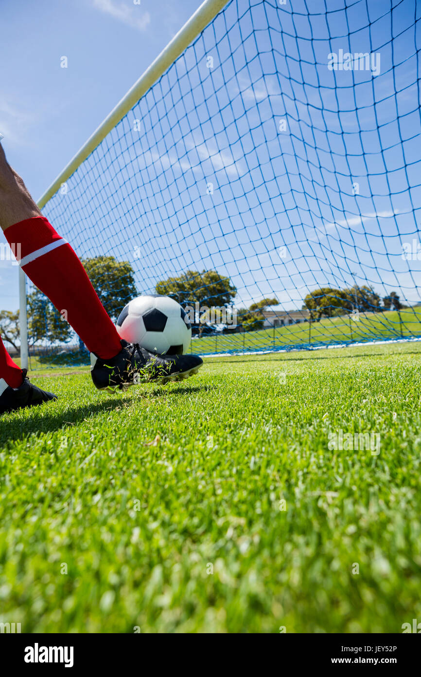 Football player scoring a goal Stock Photo Alamy