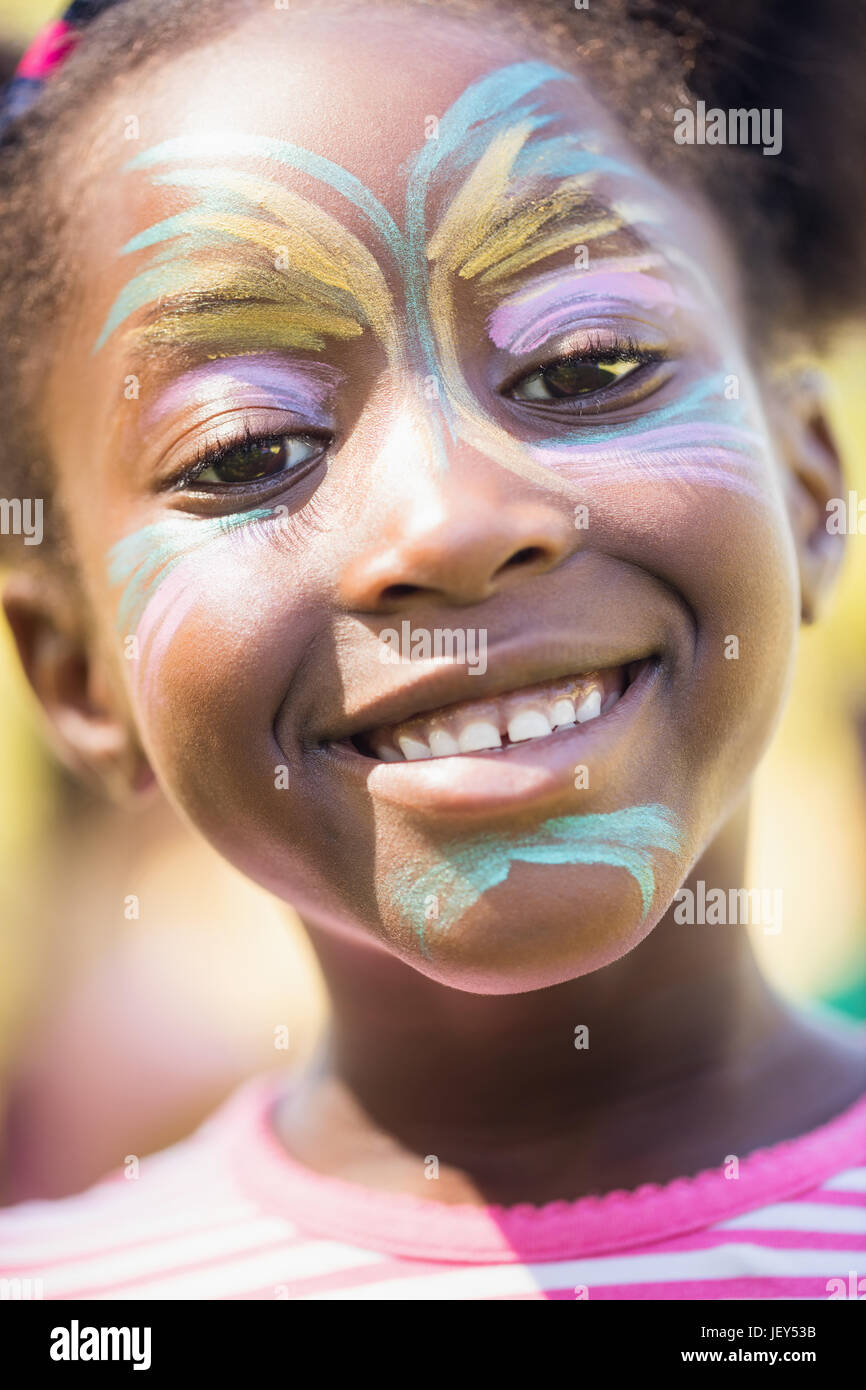 Smiling little girl with her head making up Stock Photo