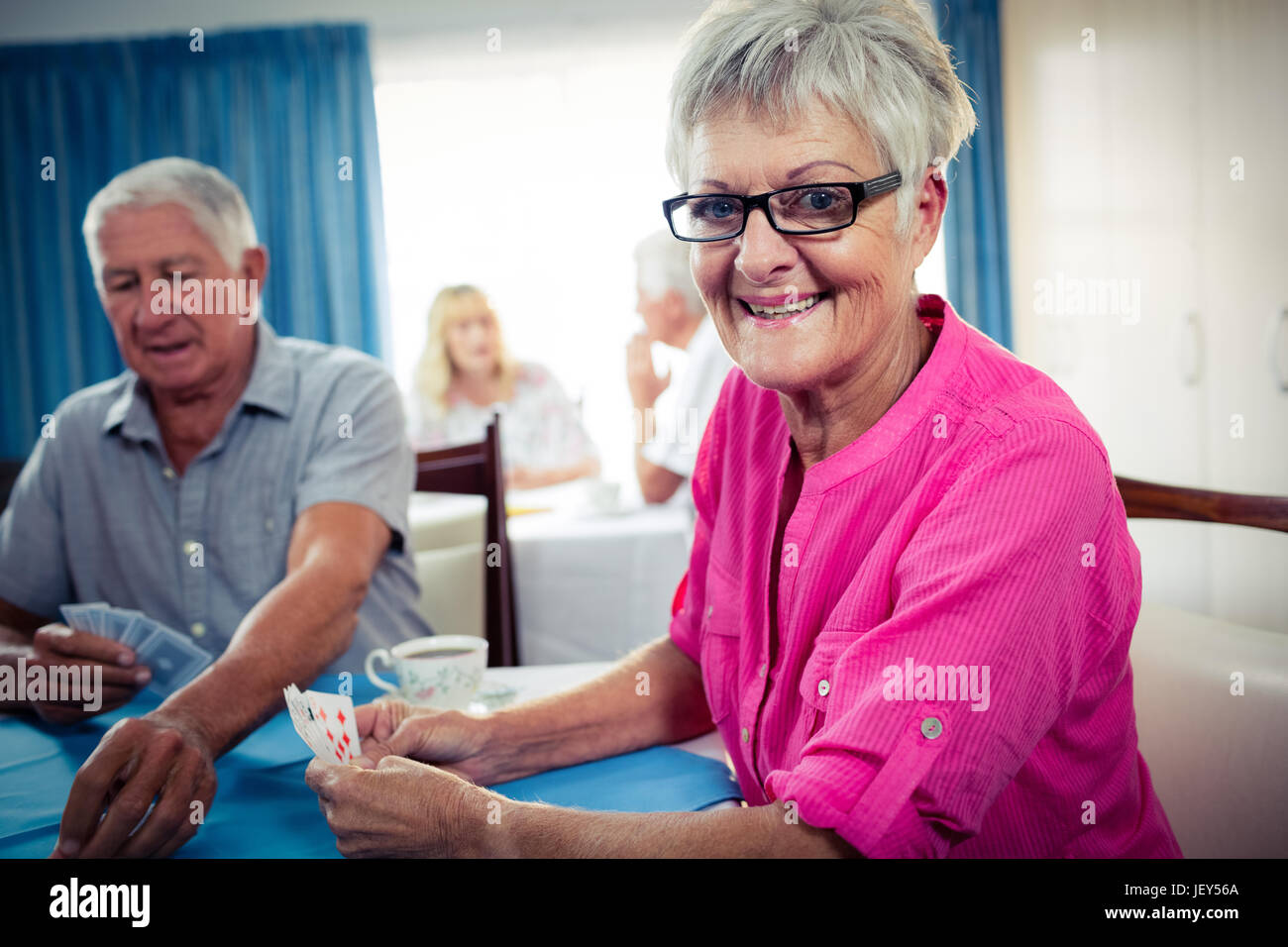 Group of seniors playing cards Stock Photo