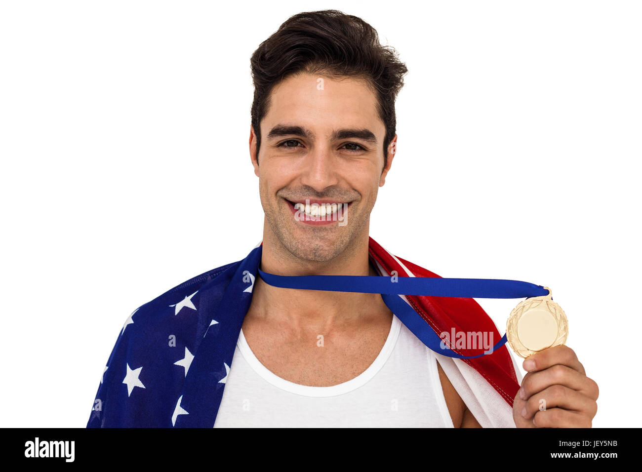 Athlete holding gold medal after victory Stock Photo - Alamy