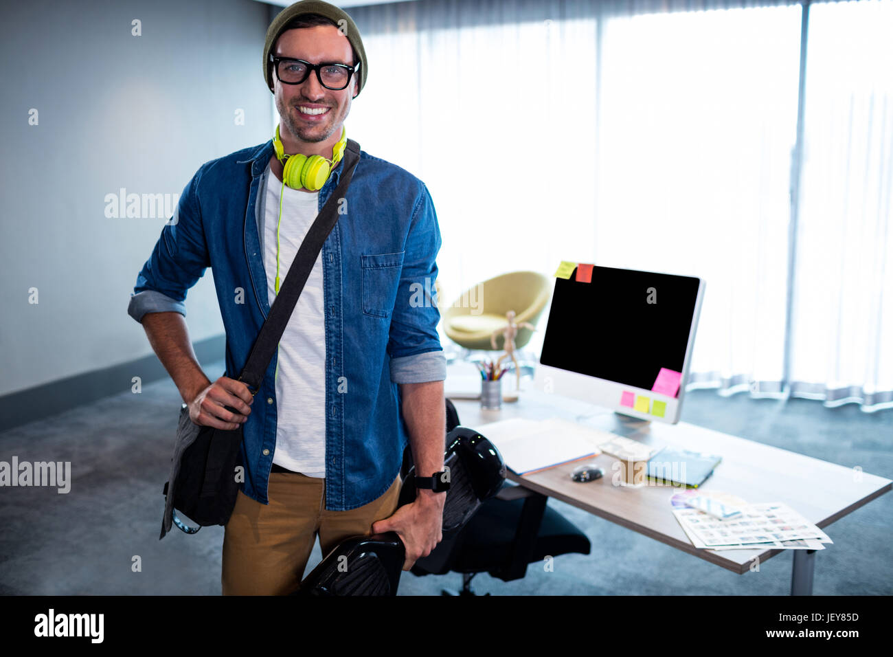 Smiling casual businessman standing Stock Photo