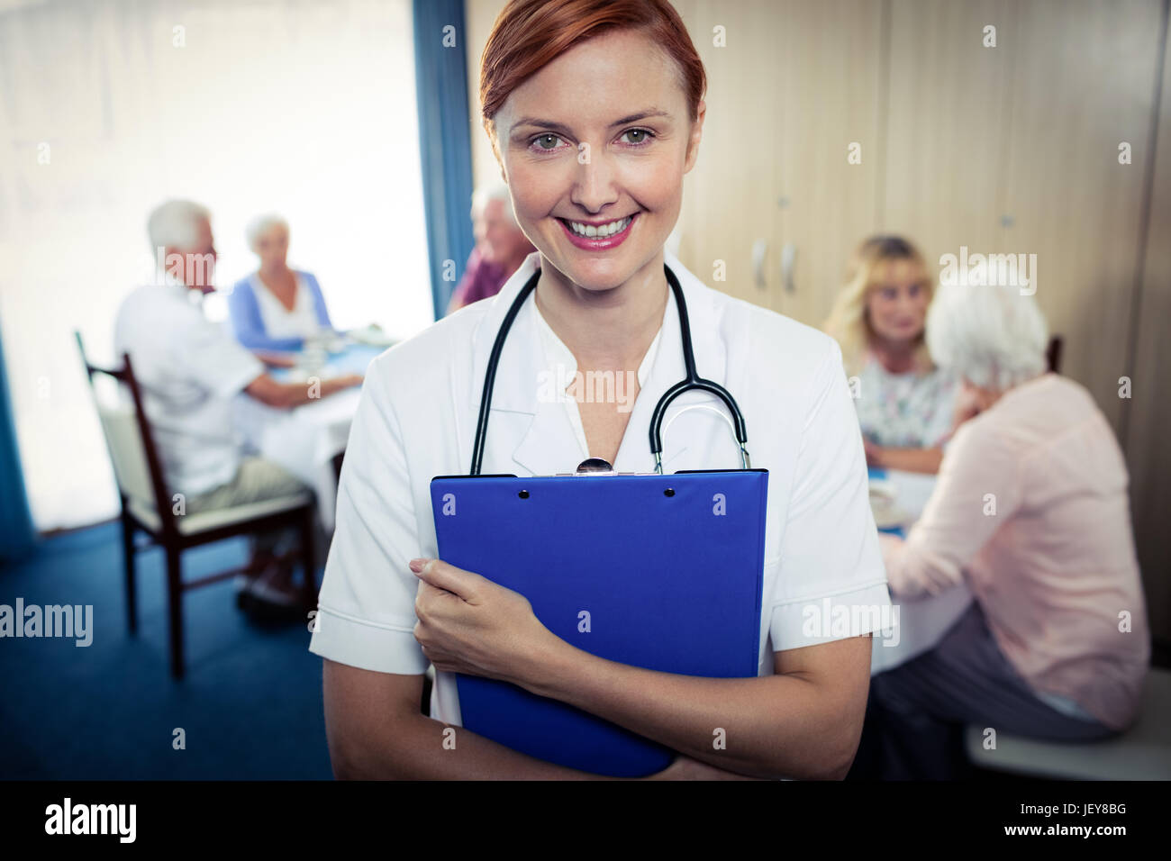 Portrait of a nurse with clipboard Stock Photo - Alamy