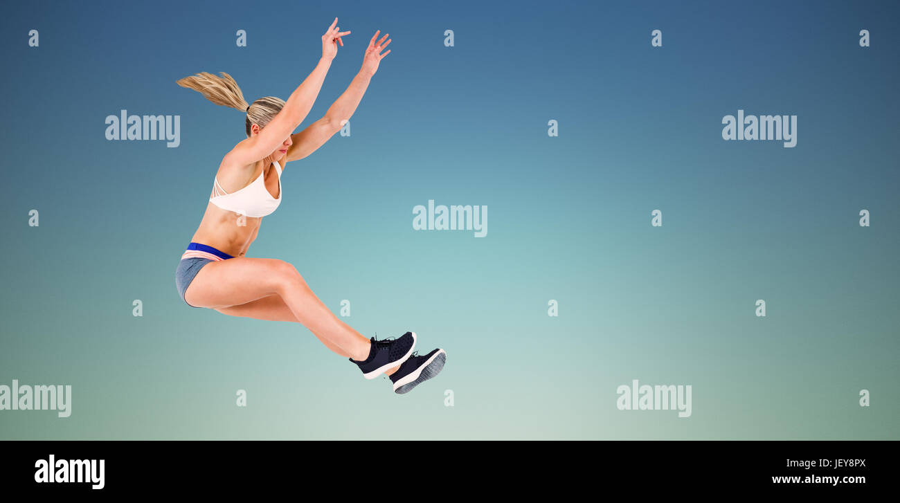 Composite image of female athlete jumping Stock Photo