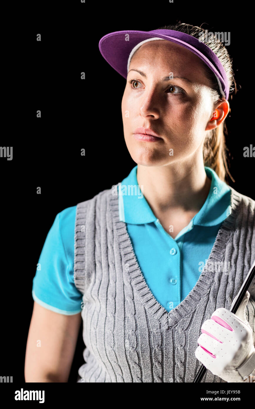 Golf player on black background Stock Photo