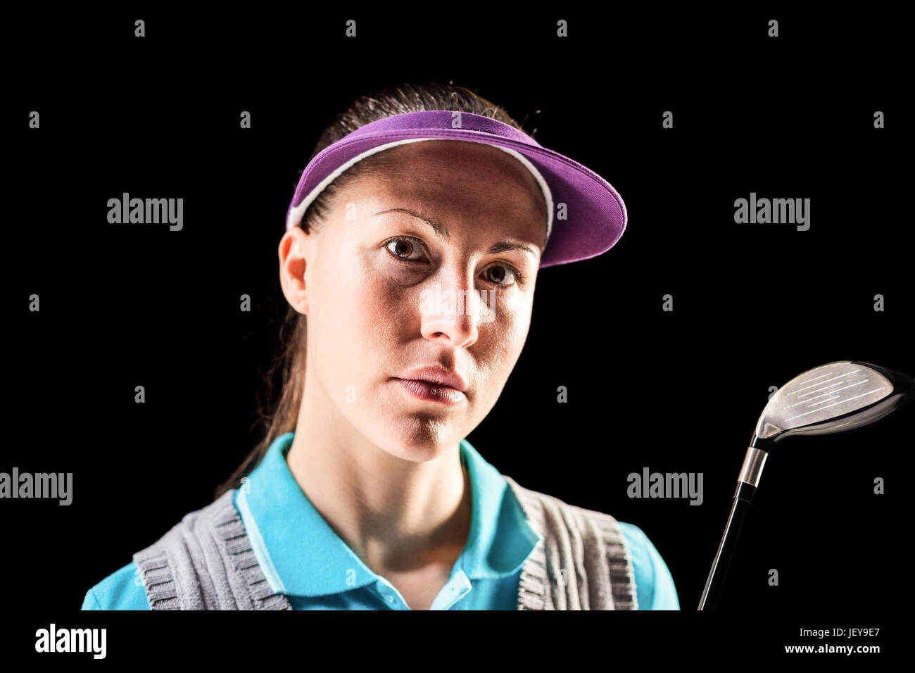 Golf player on black background Stock Photo