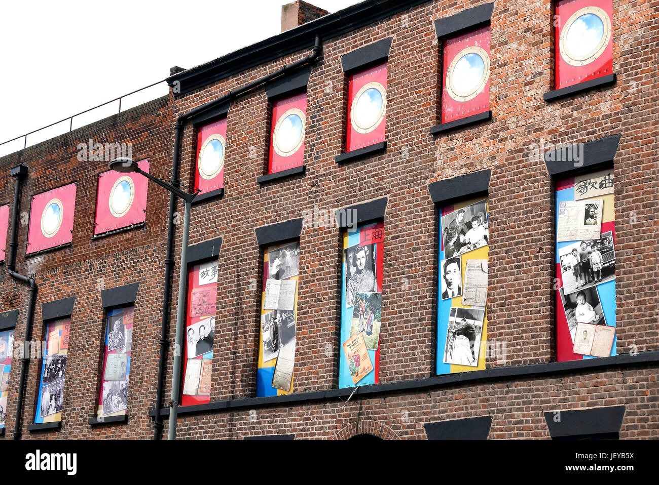 The artwork Opera for Chinatown on the wall and windows of old building on Duke Street,Chinatown,Liverpool,UK Stock Photo