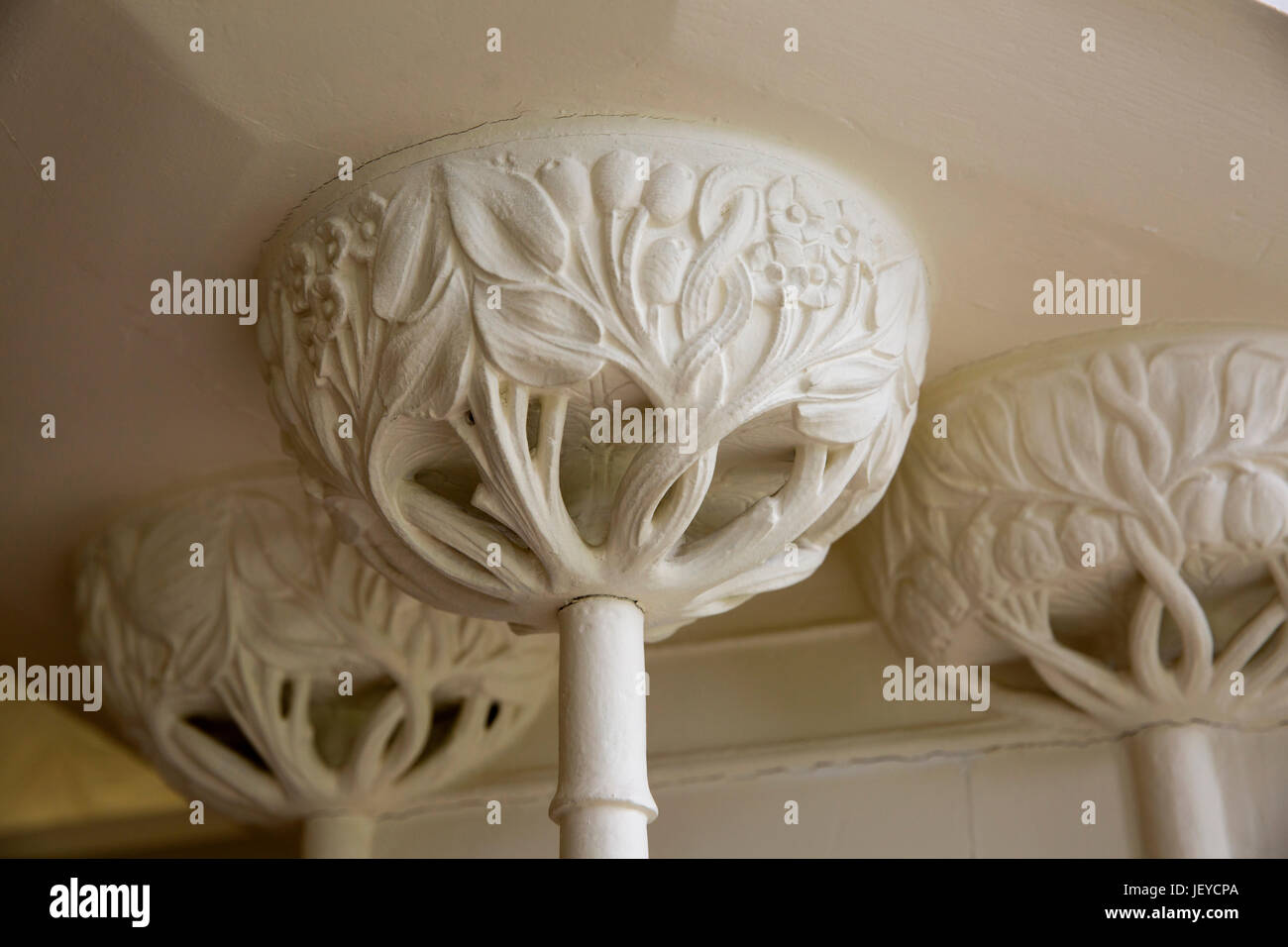 UK, Cumbria, Bowness on Windermere, Blackwell, Arts and Crafts House White Drawing Room, Baillie Scott fireplace pillar cap decoration Stock Photo