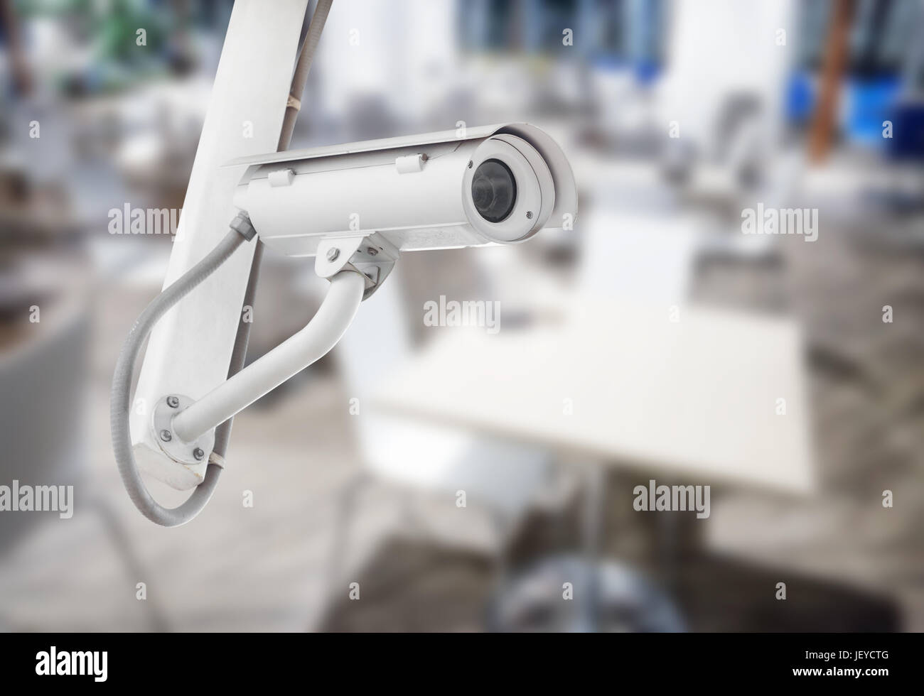 CCTV security camera with blurred restaurant background Stock Photo Alamy