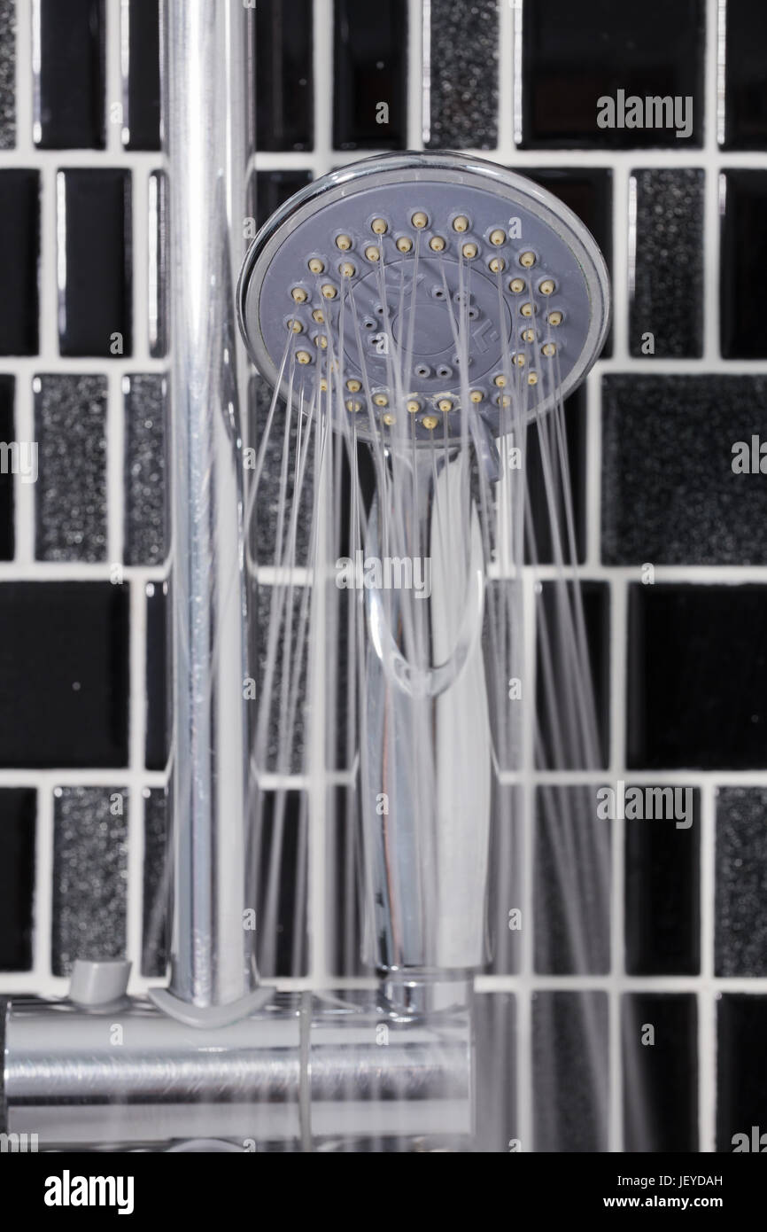 shower head in the bathroom with water drops flowing Stock Photo Alamy
