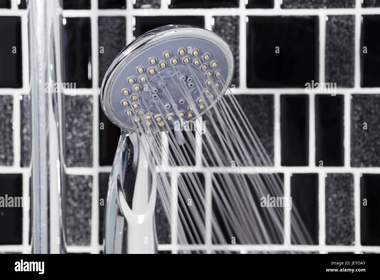 shower head in the bathroom with water drops flowing Stock Photo - Alamy