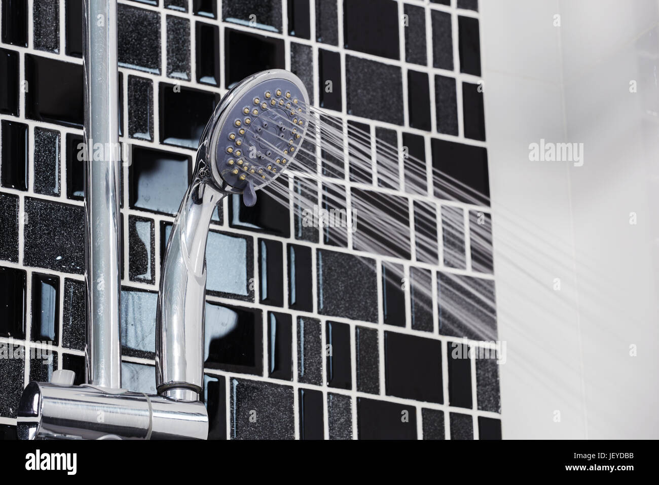 shower head in the bathroom with water drops flowing Stock Photo Alamy