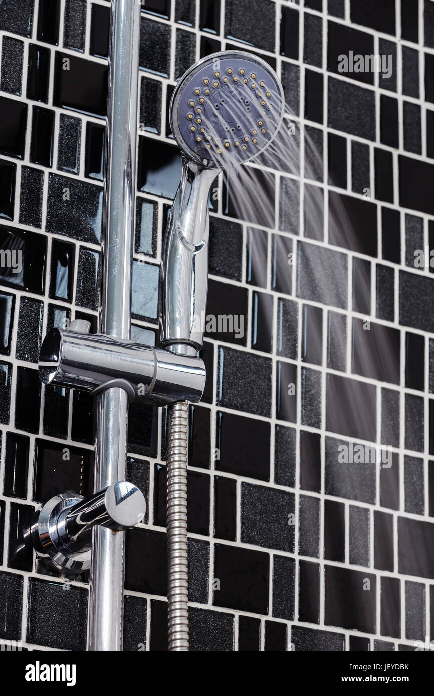 shower head in the bathroom with water drops flowing Stock Photo - Alamy