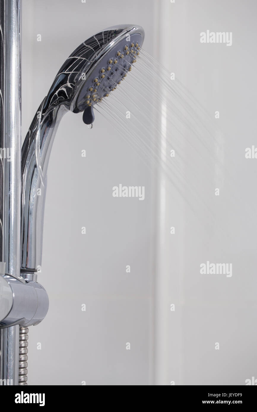 shower head in the bathroom with water drops flowing Stock Photo Alamy