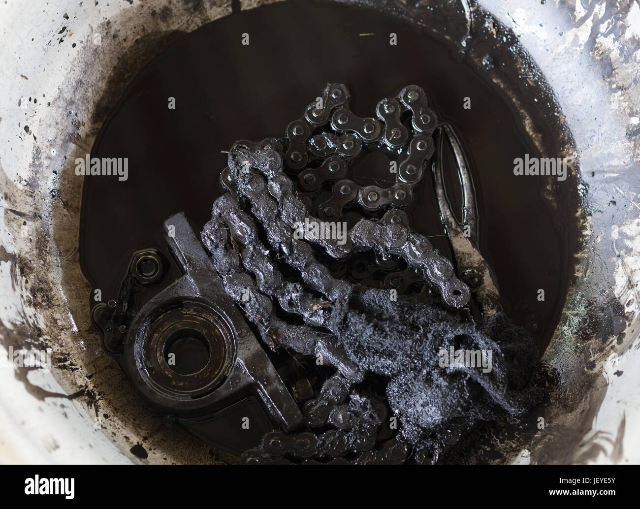 old black roller chain and bearing housing of machine Stock Photo