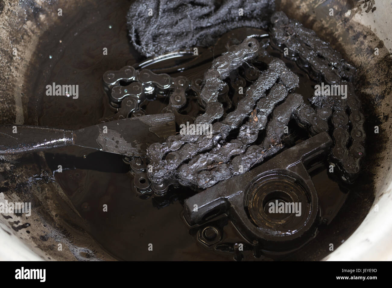 old black roller chain and bearing housing of machine Stock Photo Alamy