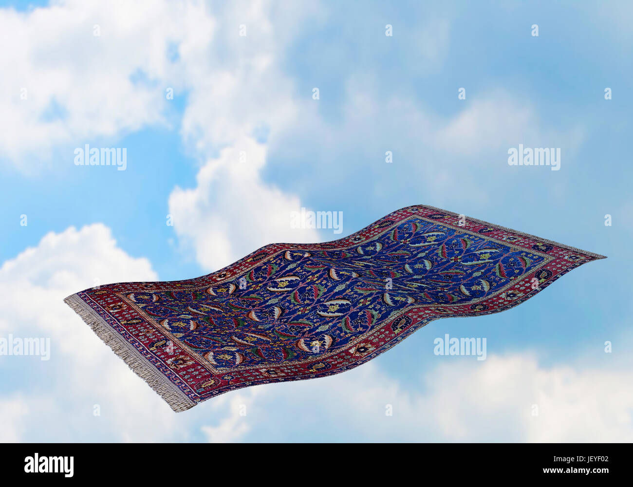 Surrealistic flying carpet against blue sky and white clouds. 3D rendering Stock Photo