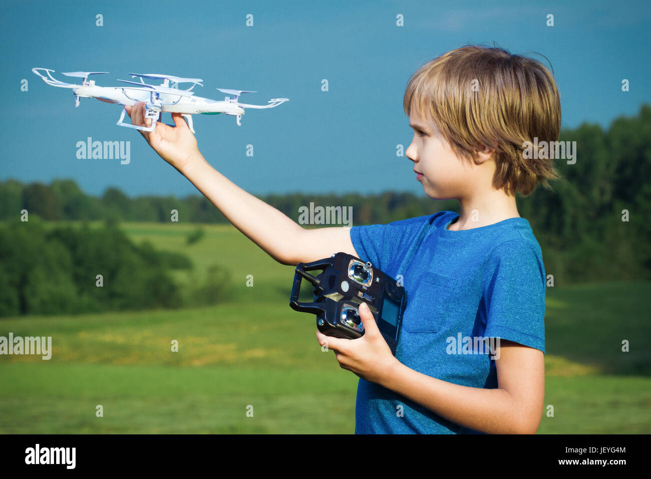 Little boy playing with drone in summer day outdoors Stock Photo - Alamy