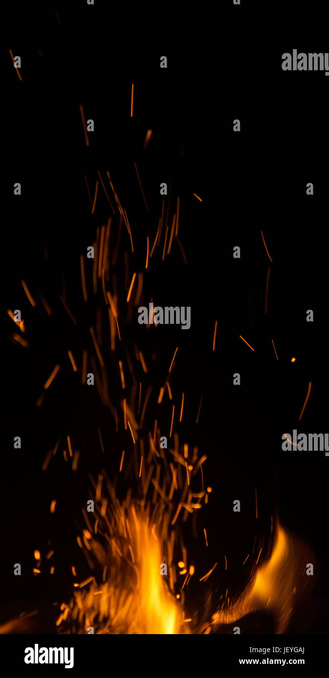 fire flames with sparks on black background Stock Photo - Alamy