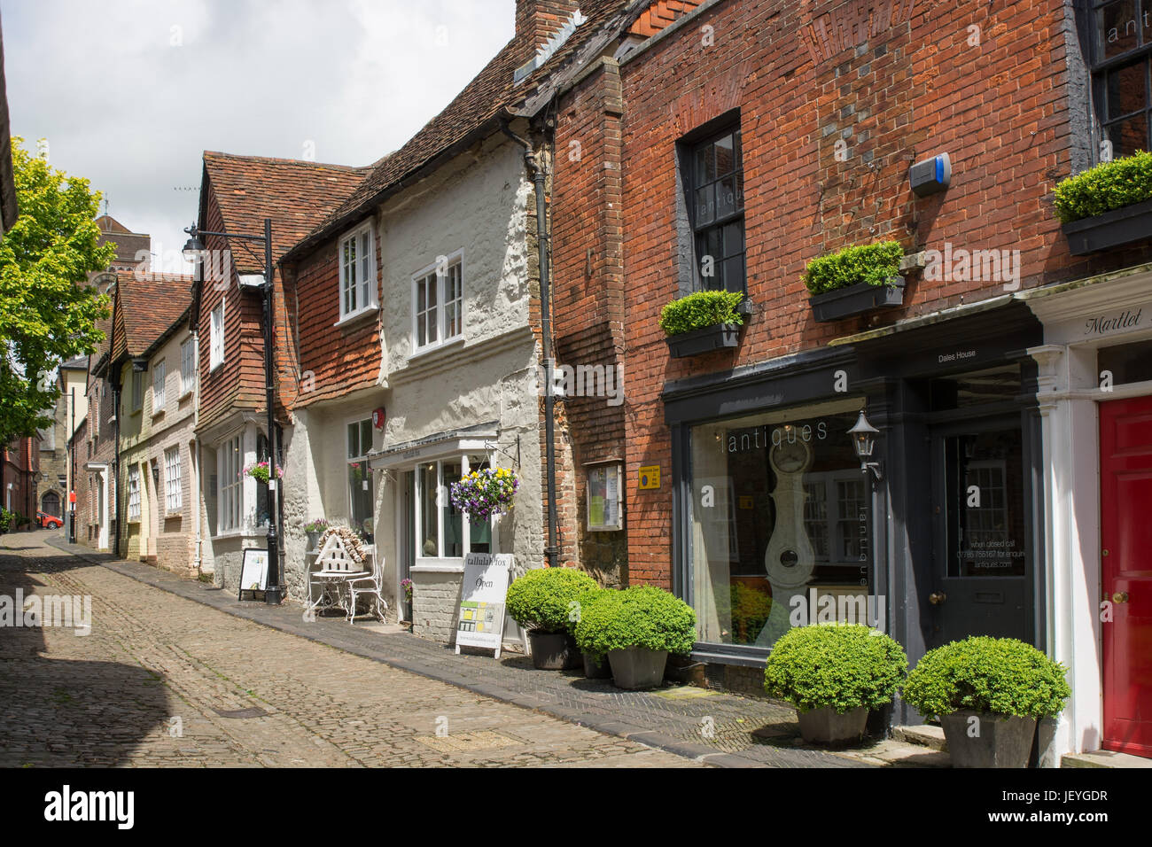 Narrow, cobbled Lombard Street in Petworth, West Sussex, England. With