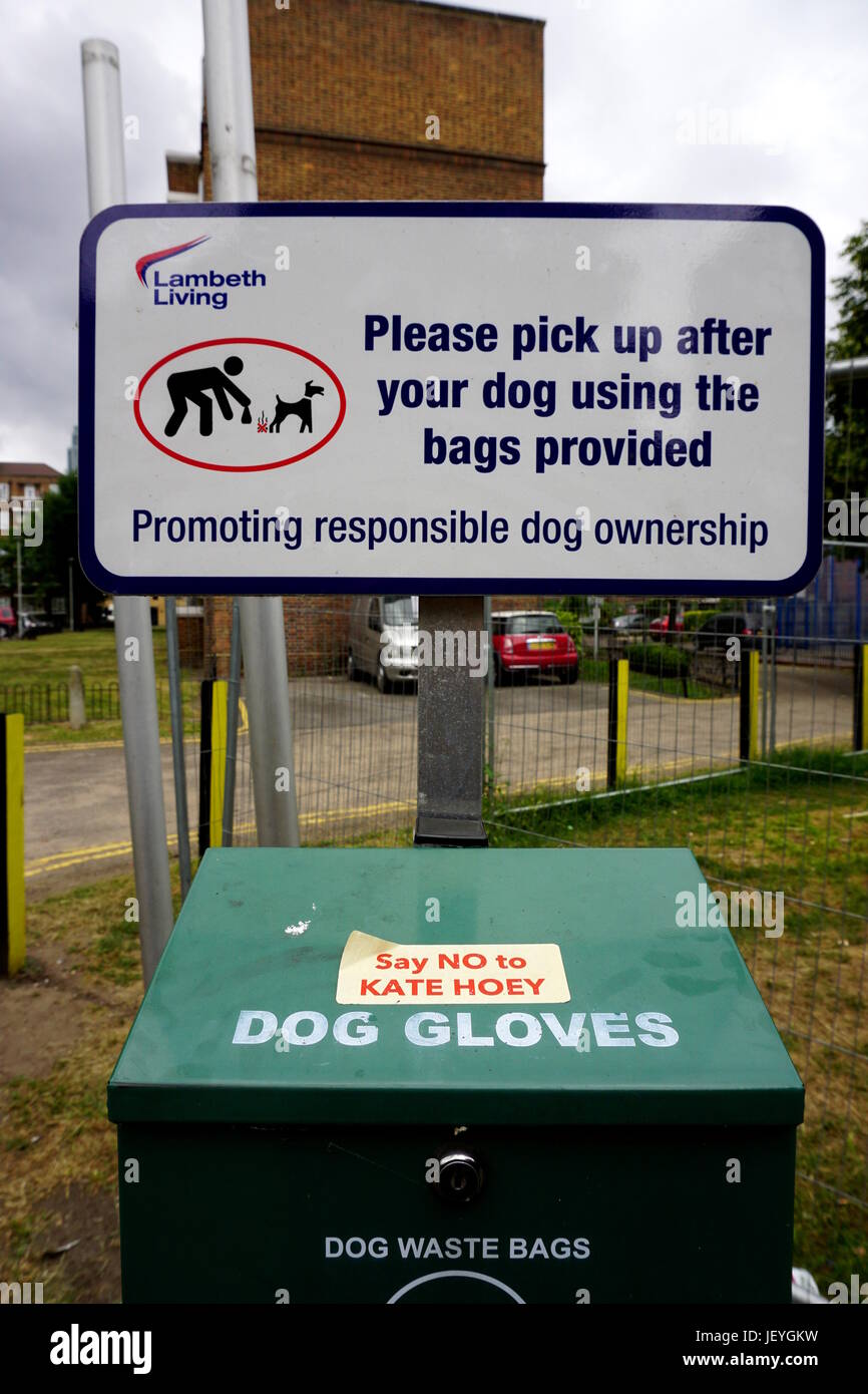 Dog poo bin with political sticker hires stock photography and images
