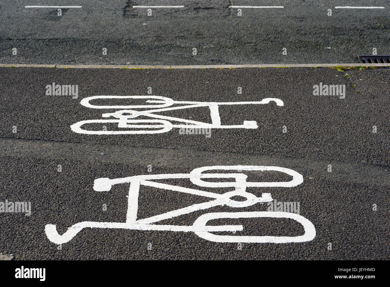 Two-way cycle path symbols painted on pavement area in Porthcawl. Wales. UK Stock Photo