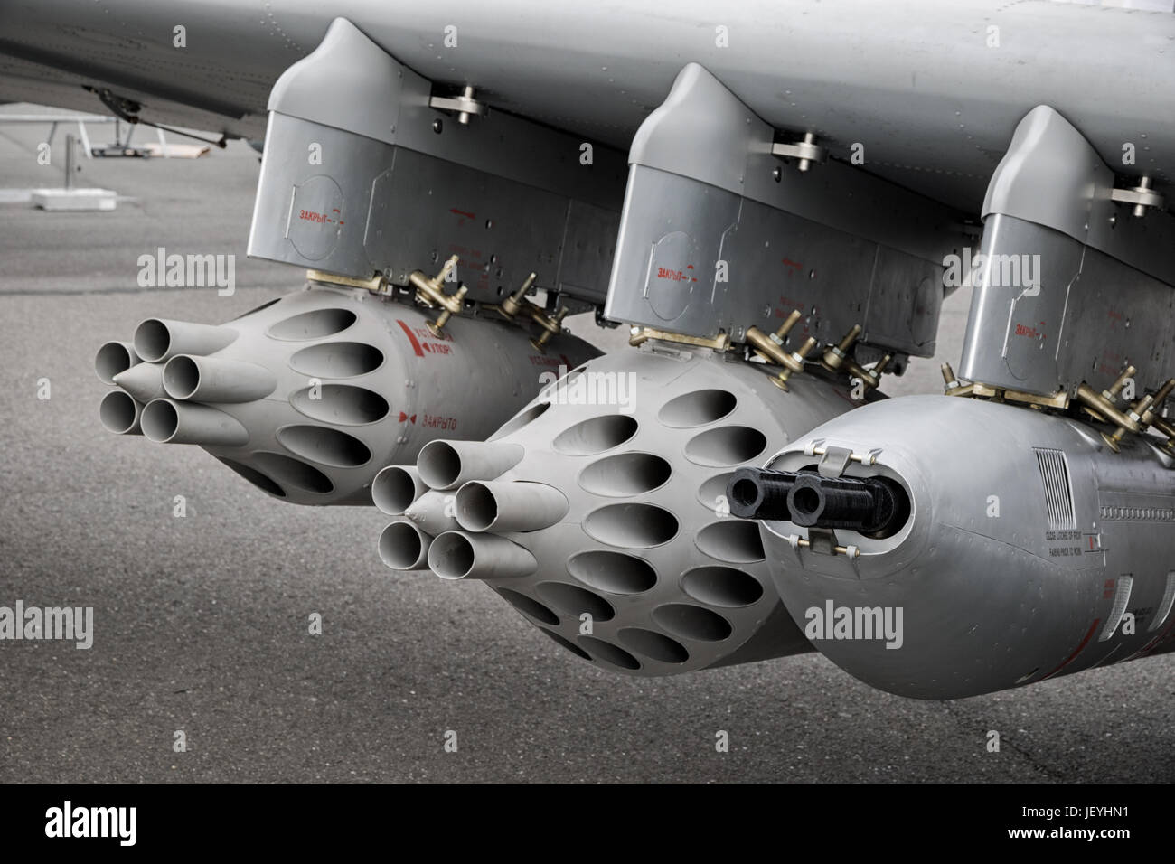 Weapon pods under the wing of a military plane Stock Photo