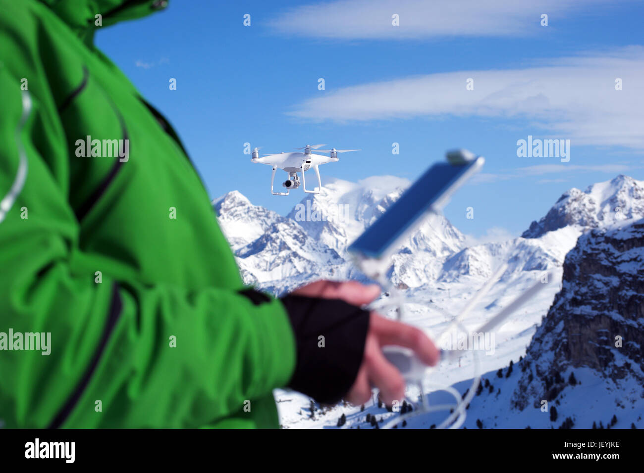 Man hands handling drone in winter Alpine landscape panorama Stock ...