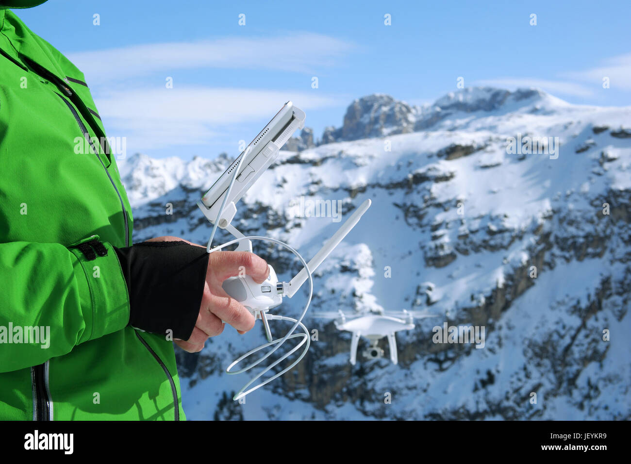 Man hands handling drone in winter Alpine landscape panorama Stock ...