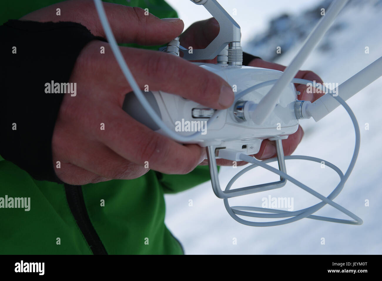 Man hands handling drone in winter Alpine landscape panorama Stock ...