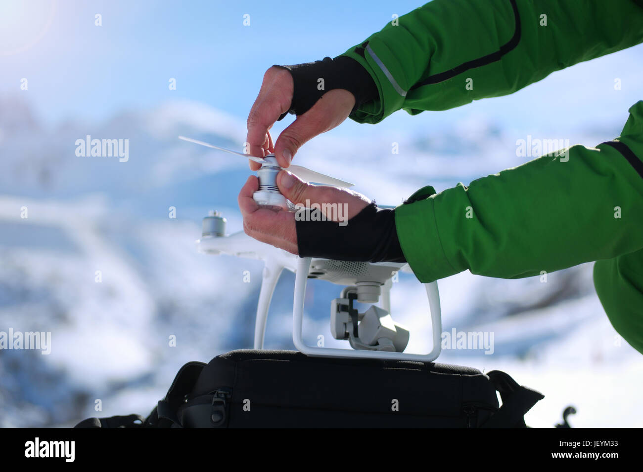 Man hands handling drone in winter Alpine landscape panorama Stock ...
