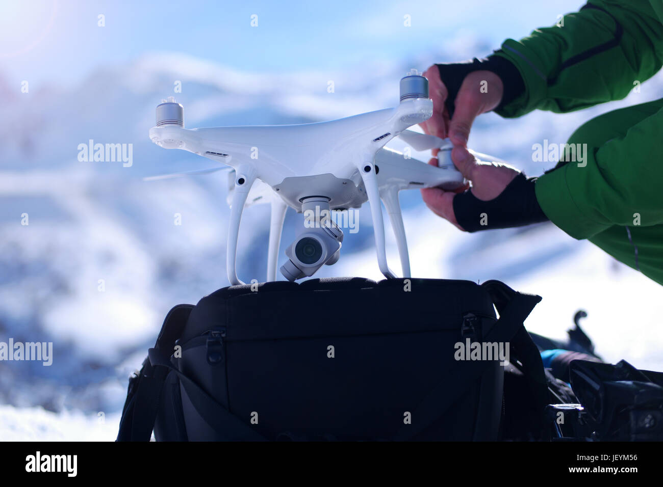 Man hands handling drone in winter Alpine landscape panorama Stock ...
