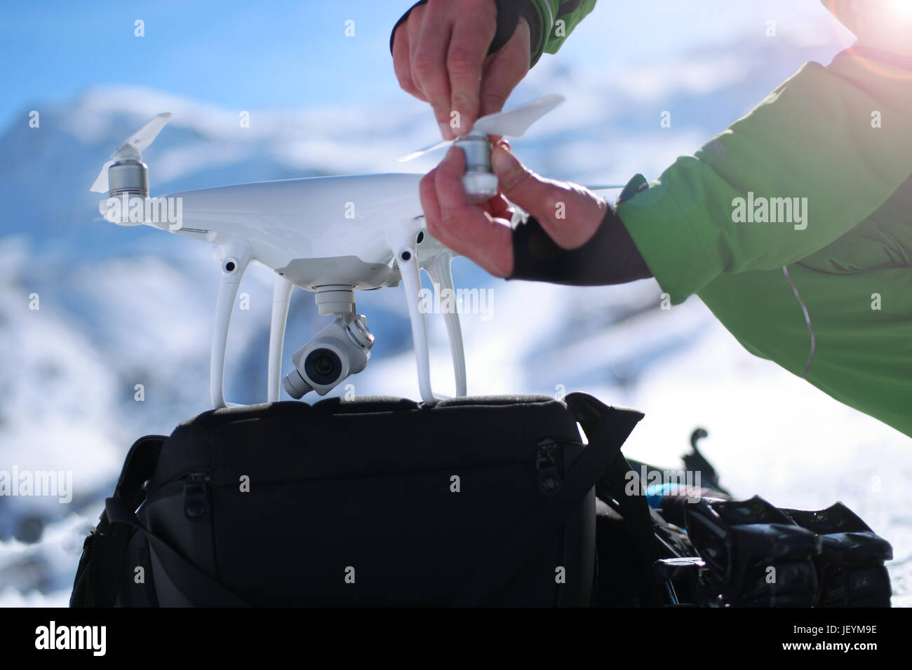 Man hands handling drone in winter Alpine landscape panorama Stock ...