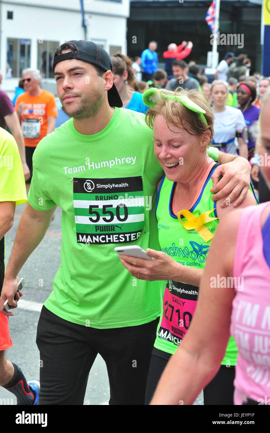 runner are seen finishing the great Manchester run, despite the