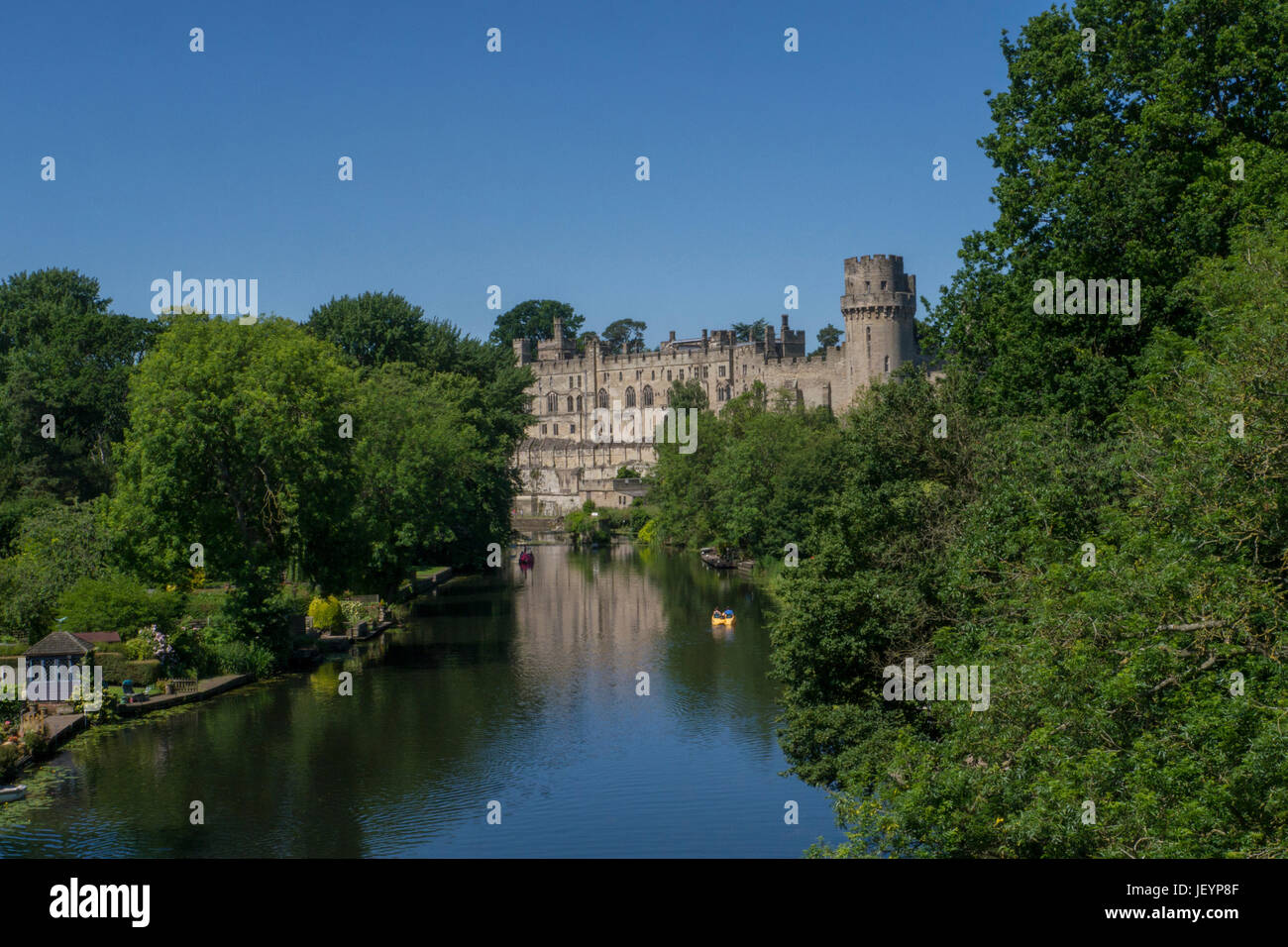 Warwick Castle & River Avon,Warwick Warwickshire,England.Warwick Castle is a medieval castle developed from an original built by William the Conqueror Stock Photo