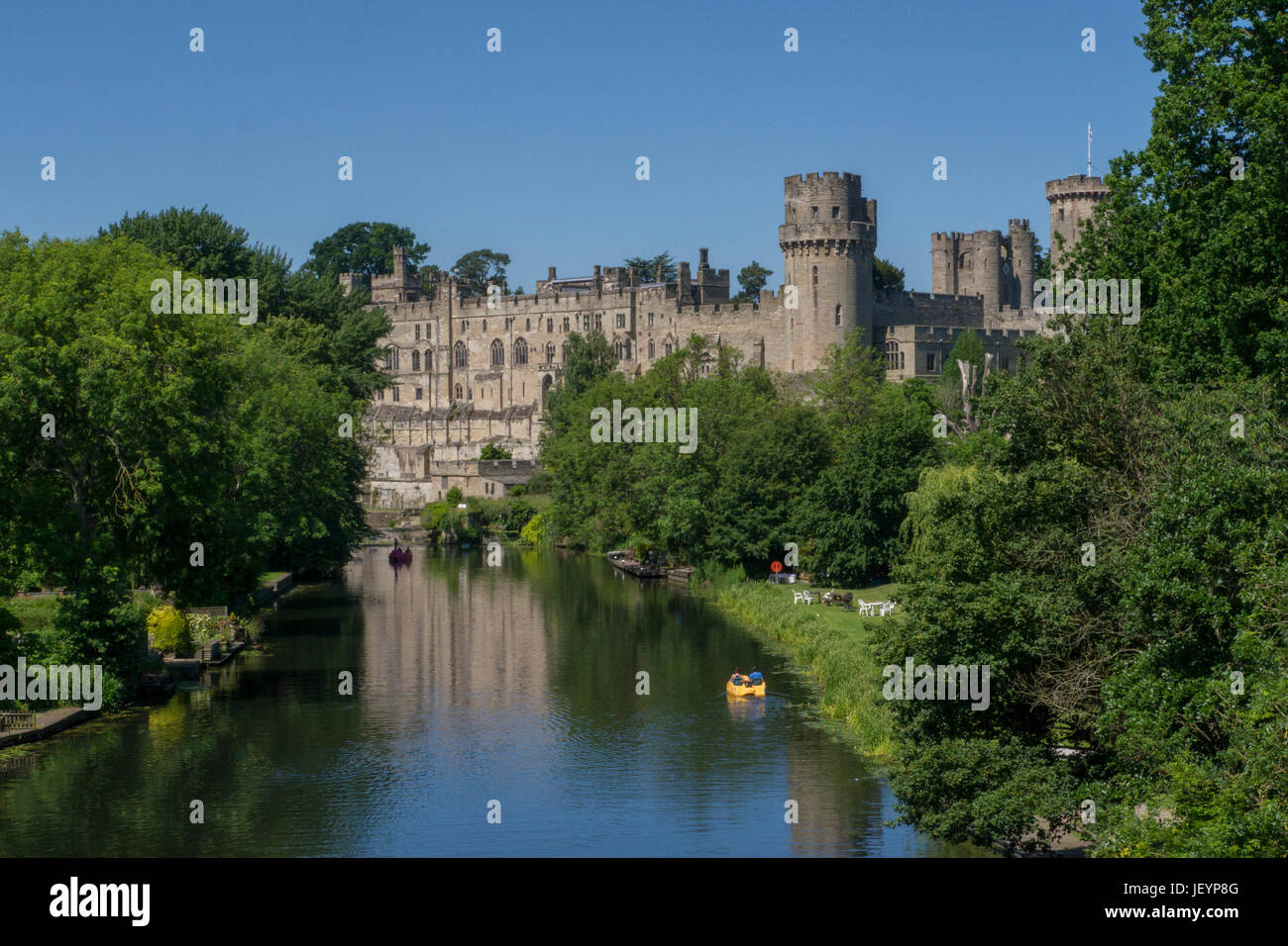 Warwick Castle & River Avon,Warwick Warwickshire,England.Warwick Castle is a medieval castle developed from an original built by William the Conqueror Stock Photo