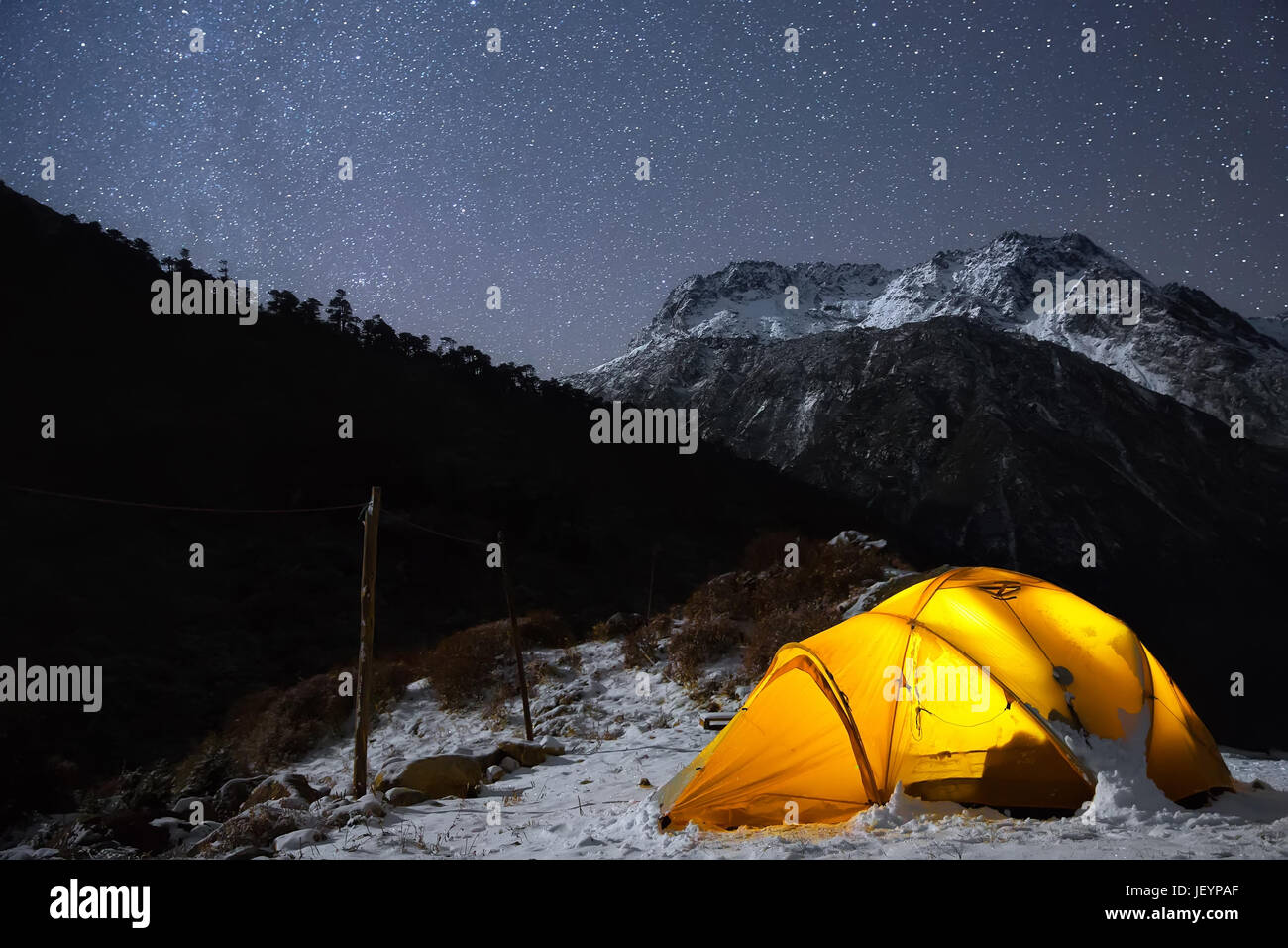 Tent high in the mountains with the stars above. Captured in Nepal, Himalayas. Stock Photo