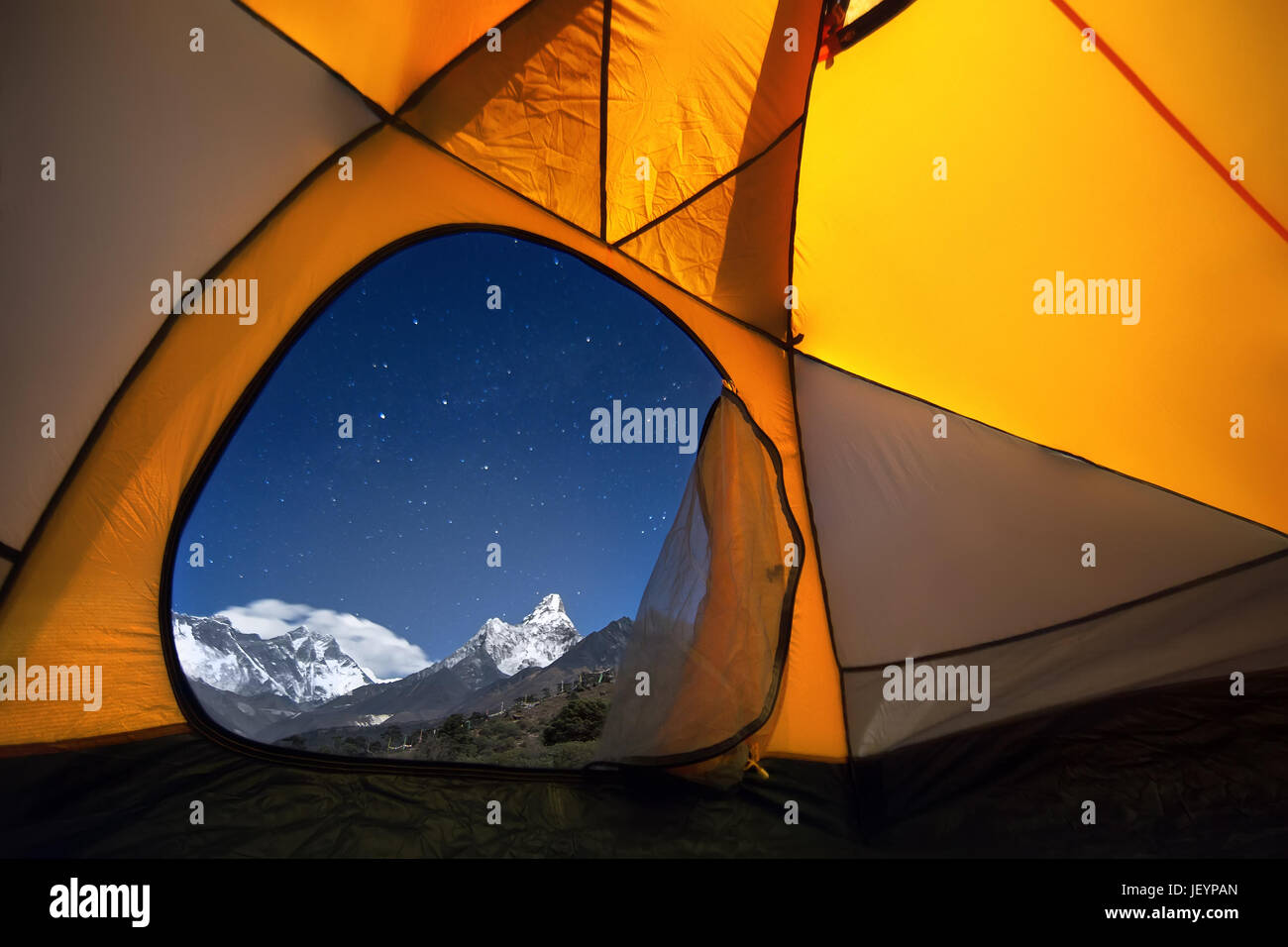 View of the mountains from a tourist tent. From the «window» from left to right there are two eight-thousanders - Mt. Everest and Lhotse. Stock Photo