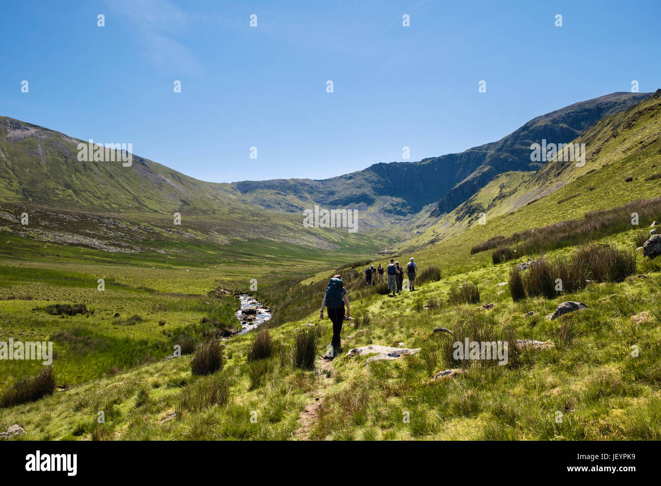 Hikers hiking in Cwm Pen Llafar in Carneddau mountains of Snowdonia National Park. Bethesda, Gwynedd, North Wales, UK, Britain Stock Photo