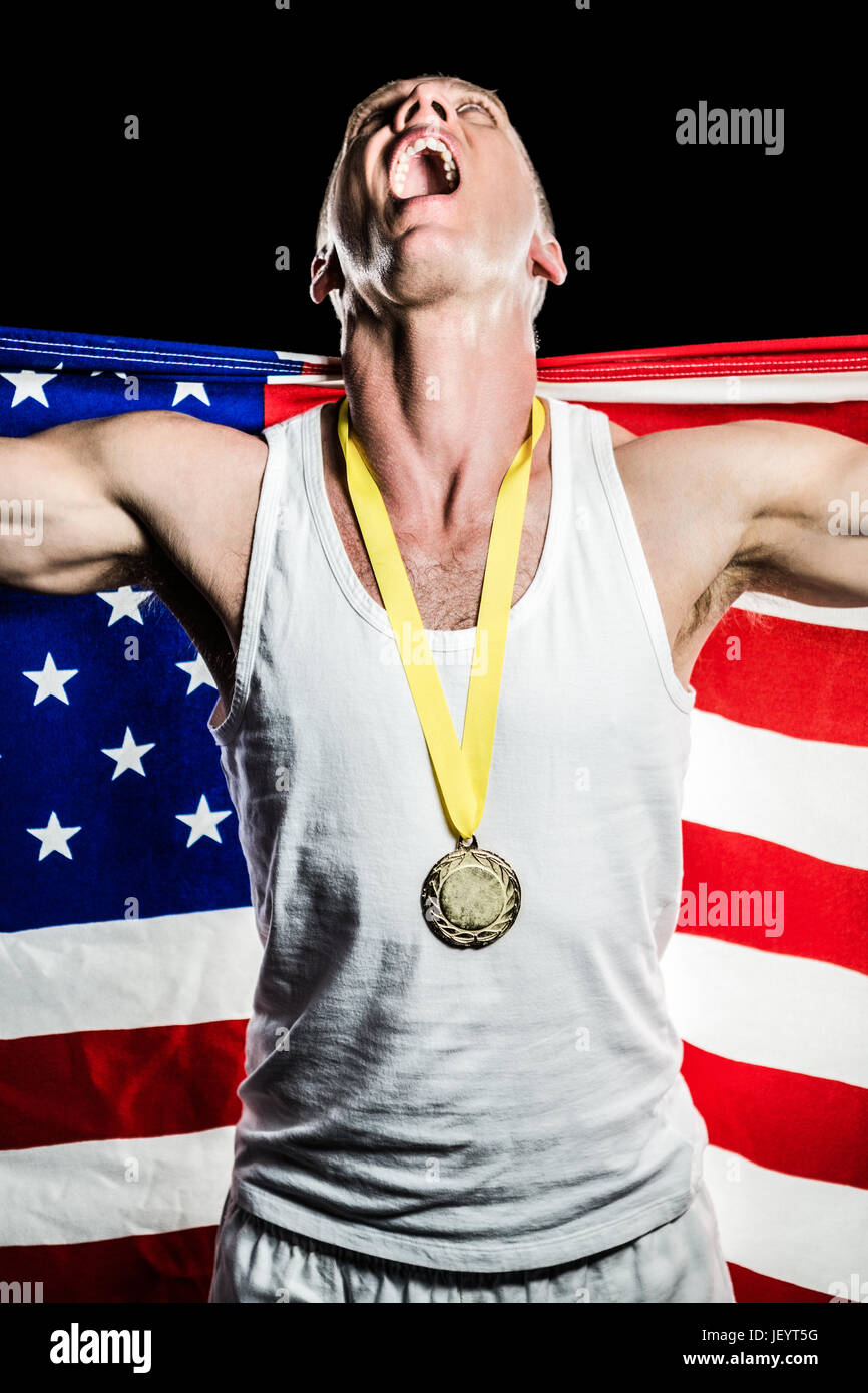 Athlete posing with gold medal after victory Stock Photo - Alamy