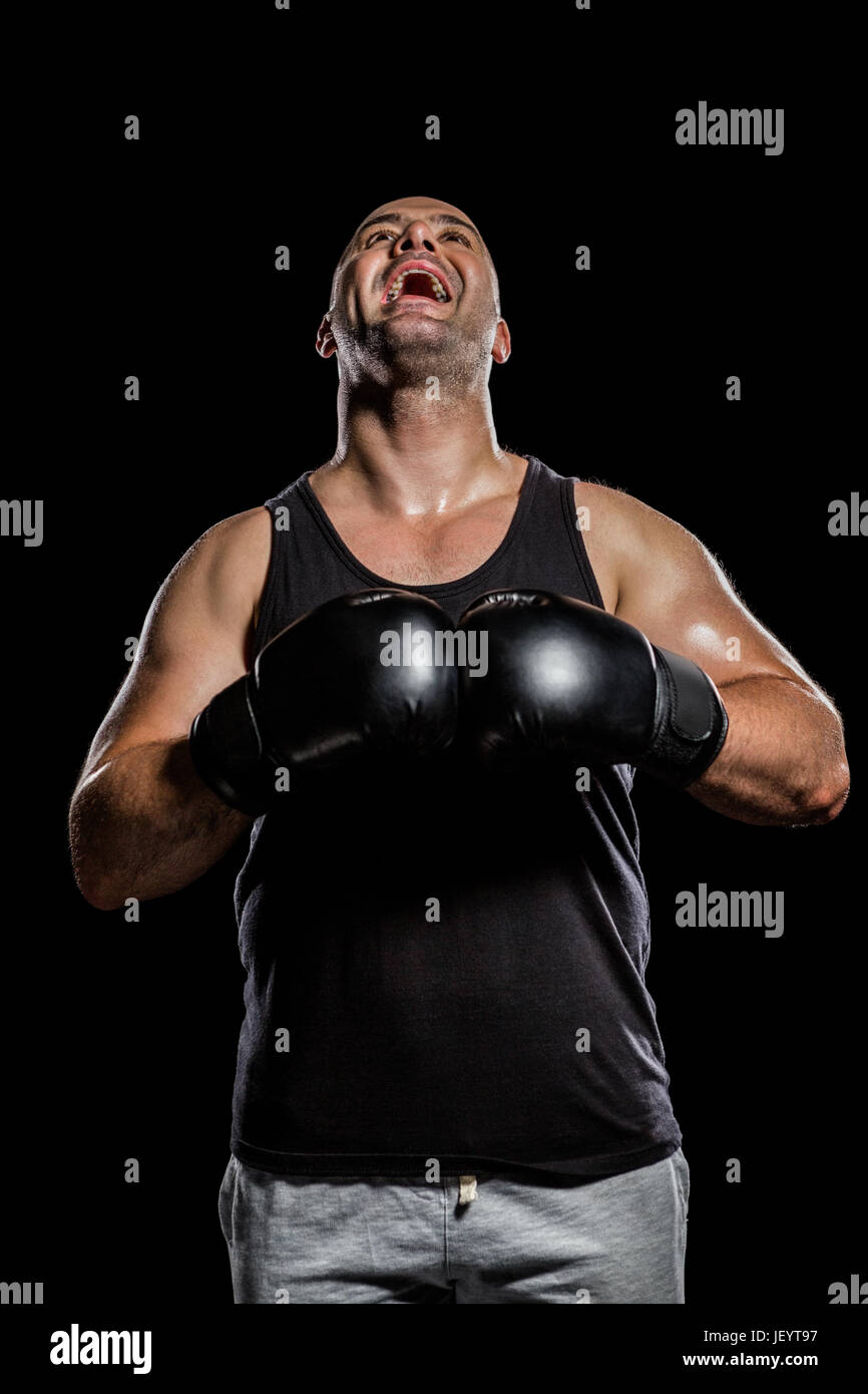 Boxer in boxing gloves laughing Stock Photo - Alamy