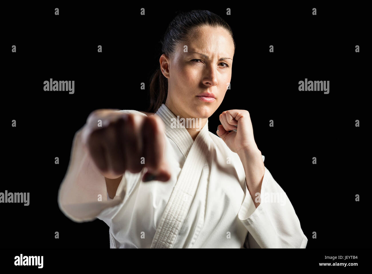 Female fighter performing karate stance Stock Photo Alamy