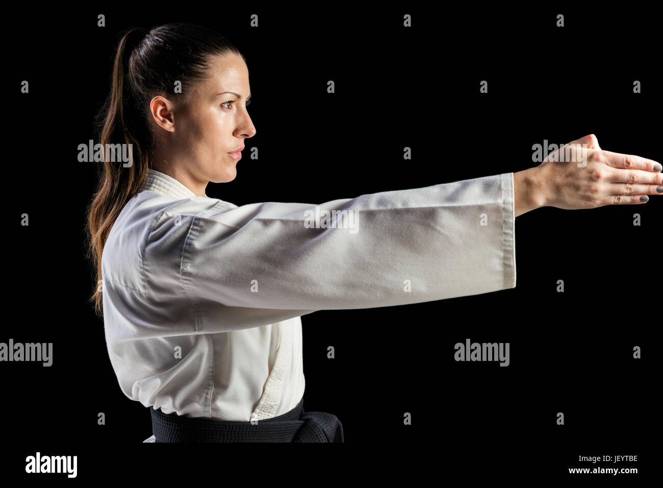 Female fighter performing karate stance Stock Photo - Alamy
