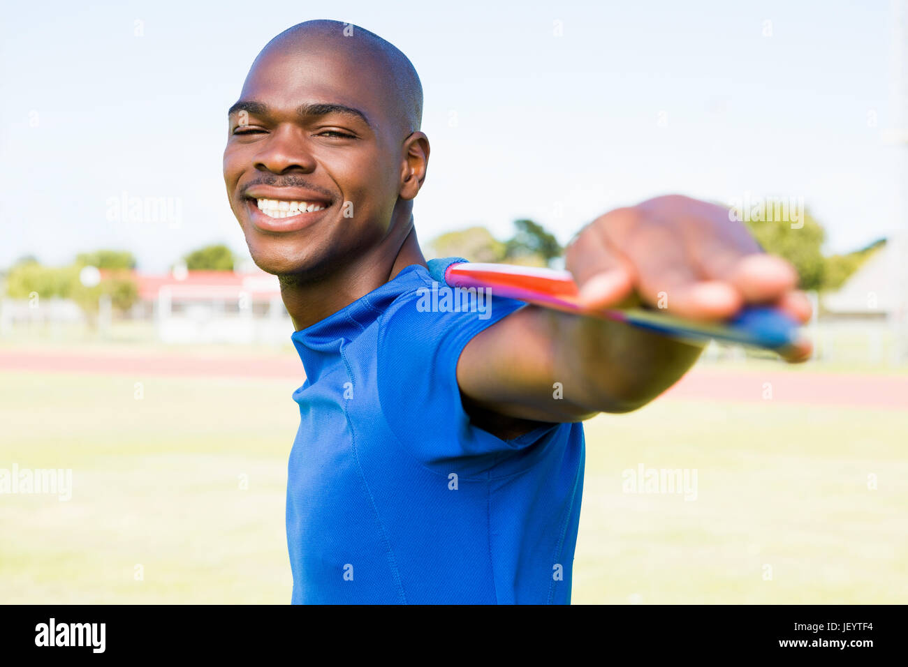 Athlete standing with javelin Stock Photo Alamy