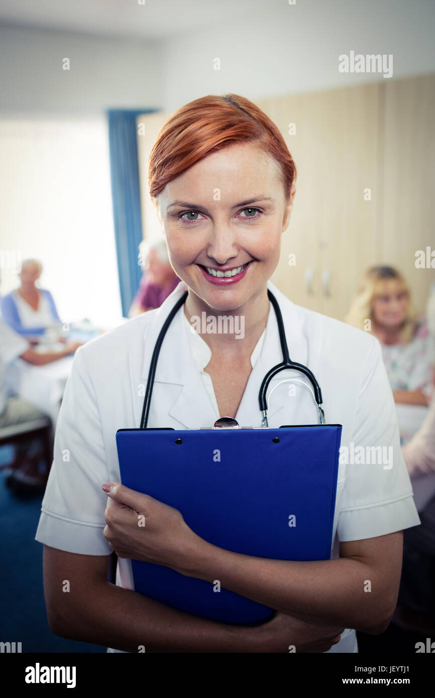 Portrait of a nurse with clipboard Stock Photo - Alamy