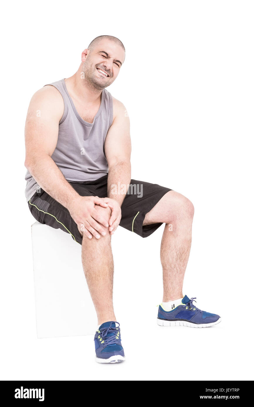 Athlete clutching knee in excruciating pain Stock Photo