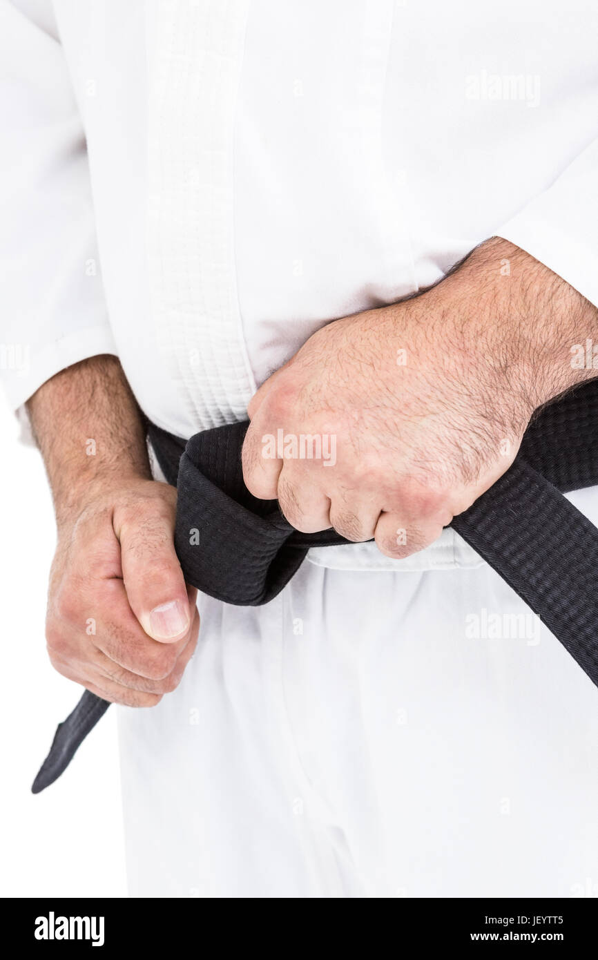 Fighter tightening karate belt Stock Photo Alamy