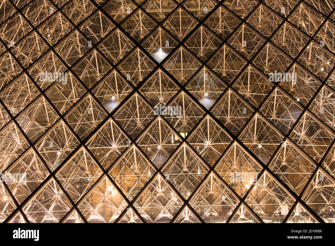 Close up view of glass pyramid at Louvre Museum (Musée du Louvre). Former historic palace housing huge art collection, from Roman sculptures to da Vin Stock Photo