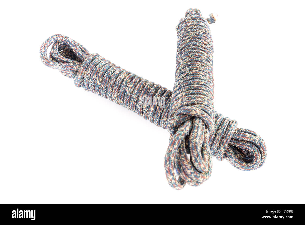 Twisted thick rope on white Stock Photo - Alamy
